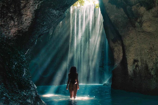 Bali Instagram Tour : Heaven Gate Tour - Tirta Gangga - Tukad Cepung Waterfalls - Tukad Cepung Waterfall: the cliff cave feeling and light through the rocks