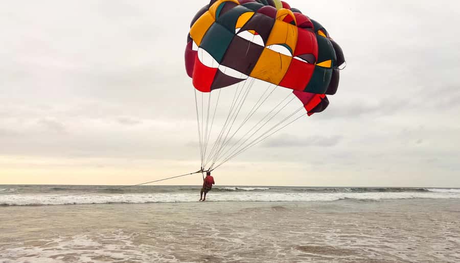 Bali: Parasailing, Jet Ski & Uluwatu Tour with Kecak Dance - Uluwatu Temple on a cliff: Culture, modest dress, and monkey-proof thinking
