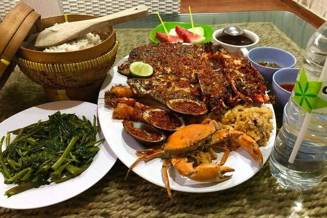 Romantic Seafood Dinner at Jimbaran Beach Bali include Sunset - Where you meet at Ganesha cafebay, and the pickup reality